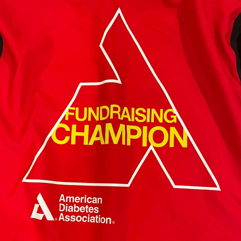 Cycling windbreaker by Primal with ADA charity-ride graphics